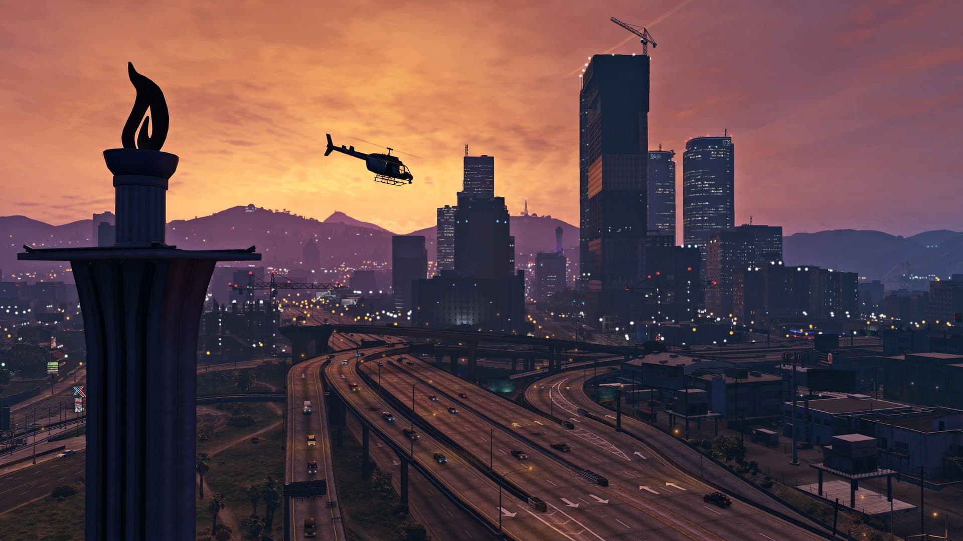 Los Santos au crépuscule, un hélicoptère au-dessus des autoroutes du centre